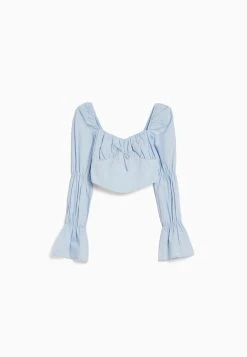 BERSHKA Cropped Long Sleeve- Blouse - Light Blue -dress shop 0dc28d7a822346fcb62c1a356e5c3d94